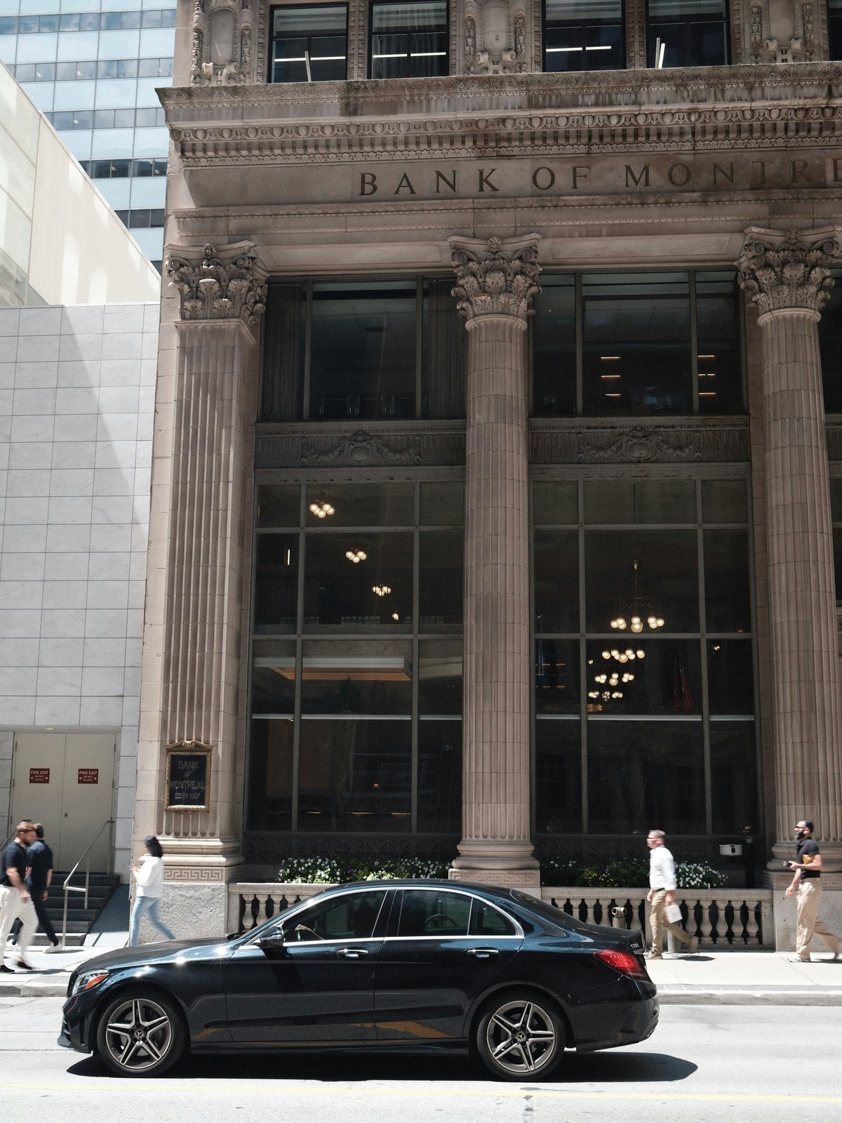 The stone facade of a historic Bank of Montreal building
